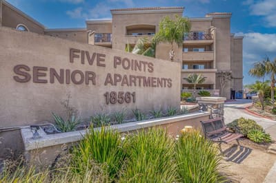 Exterior view of Five Points Senior Apartments sign