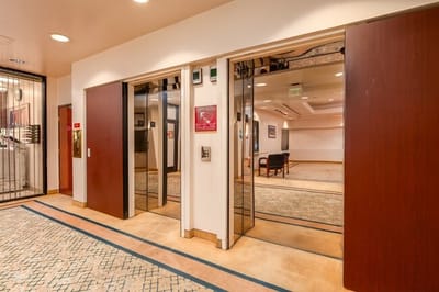 Interior view of a hallway with elevators