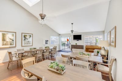 Bright common area with tables and seating