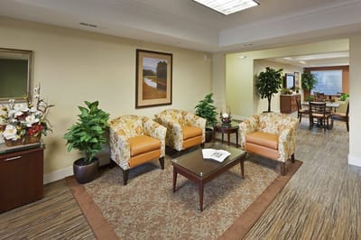 Bright common area with comfortable seating and plants