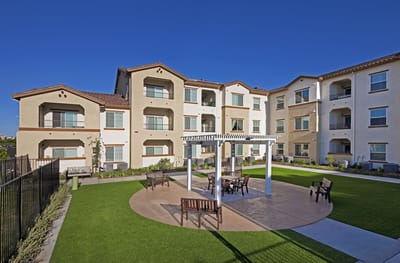 Outdoor gathering area with seating and landscaping