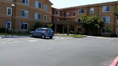Exterior view of Russell Manor with parking area