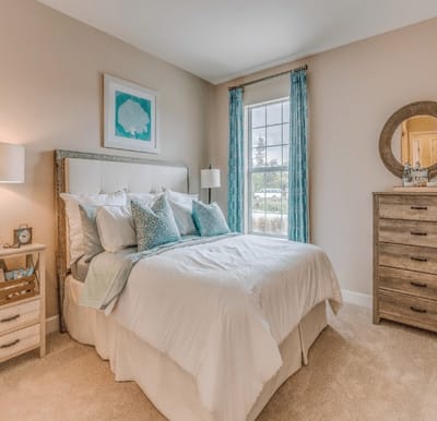 Cozy bedroom setup with stylish decor and natural light