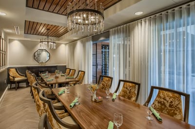 Elegant dining room setup with decorative chairs and tableware