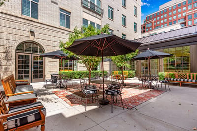 Outdoor courtyard with tables and umbrellas