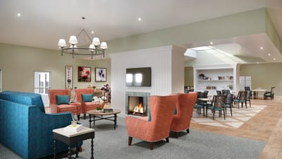 Bright common area with seating and dining space