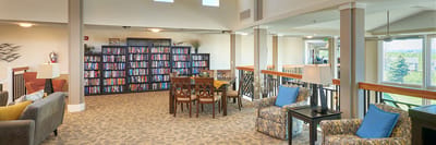 Common area with seating and bookshelves