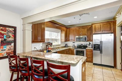 Modern kitchen with granite countertops and appliances