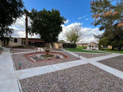 Outdoor garden area with fountain and gazebo
