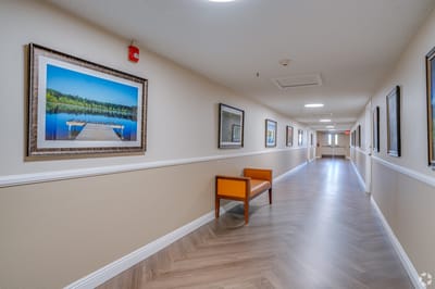 Interior hallway featuring artwork and benches