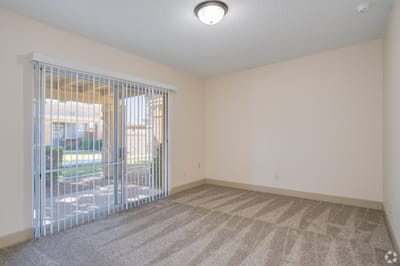 Bright and empty interior room with sliding doors