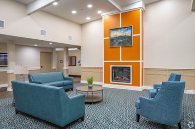 Interior lounge area with comfortable seating and a fireplace