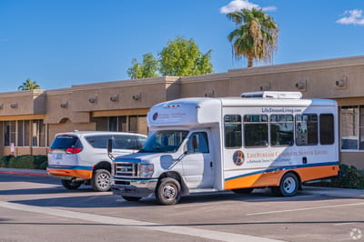 Facility transport vehicles parked outside the building