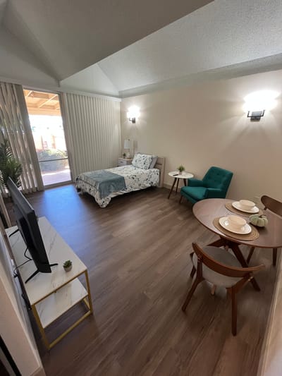 Cozy resident room with a bed and dining table