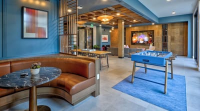 Interior view of a common area with seating and games