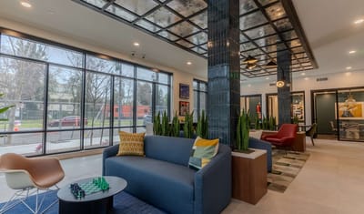 Modern lobby area with seating and plants