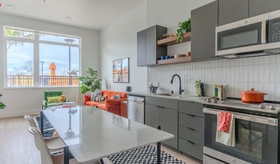 Modern kitchen and living area in a senior living facility