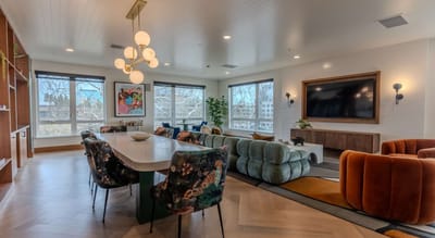 Bright common area with modern furnishings and large windows