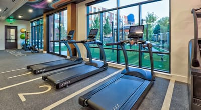 Interior view of a fitness area with treadmills