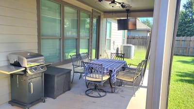 Patio area with seating and grill