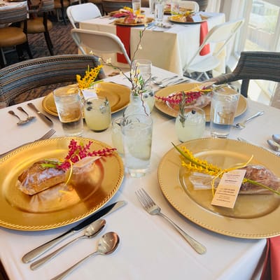 Beautifully set dining table with gourmet meals and drinks