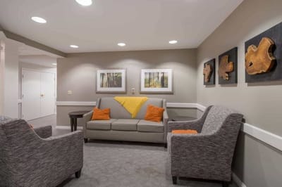Cozy seating area in a common space with artwork