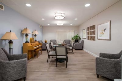 Interior common area with seating and a piano