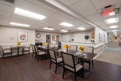 Dining area with tables and flower centerpieces