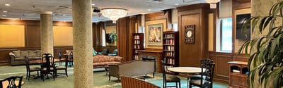Interior common area with seating and bookshelves