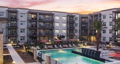 View of the outdoor pool and surrounding building.