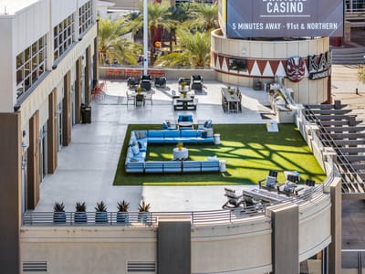 Outdoor lounge area with seating and landscaping