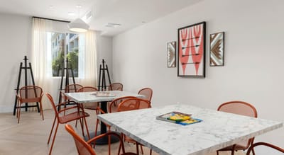 Bright and modern interior activity space with tables