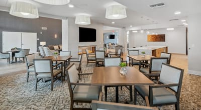 Bright common area with tables and seating