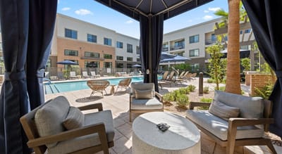 Outdoor lounge area with seating and pool