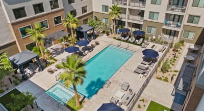 Aerial view of a modern pool area with seating
