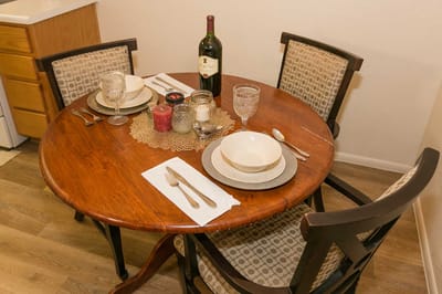 Dining table set for a meal in a cozy setting