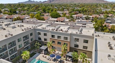 Aerial view of the facility with pool and outdoor seating