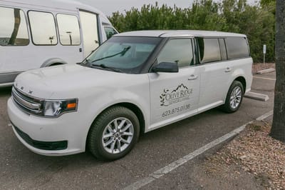 Facility transport vehicle parked in the lot