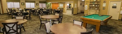 Interior dining area with tables and pool table