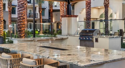 Outdoor amenities with a grill and seating area