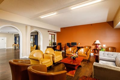Common area lounge with seating and workstations