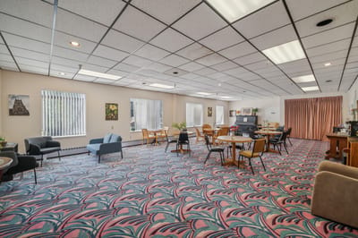 Interior view of a common area with colorful carpet