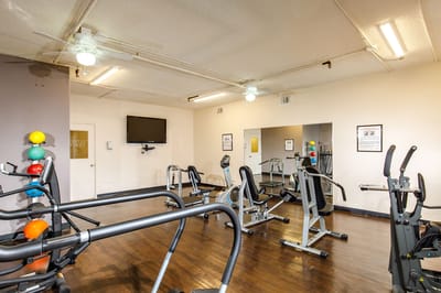 Interior view of a gym equipped with exercise machines
