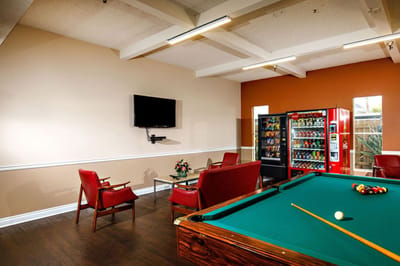 Common area with pool table and vending machines