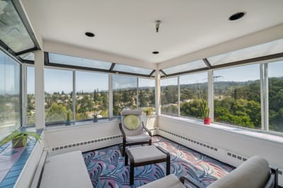 Sunroom with large windows and scenic view