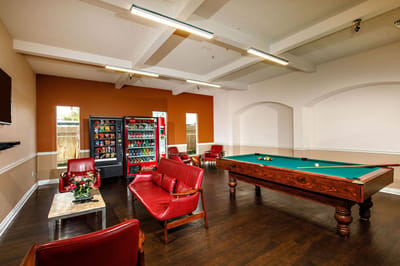 Common area with a pool table and seating