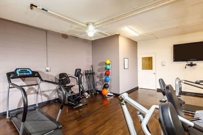Interior view of a fitness area with exercise equipment