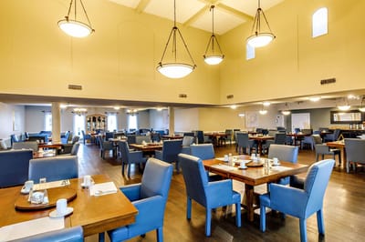 Spacious dining room with tables and chairs