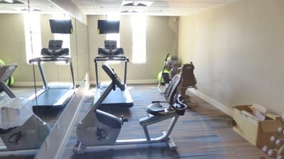 Interior view of a fitness area with exercise equipment