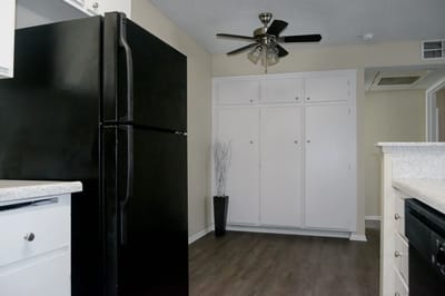 Interior view of a kitchen space with refrigerator